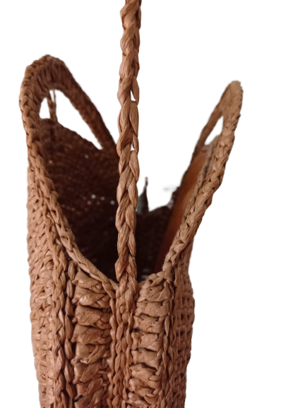 A brown Raffia Bag